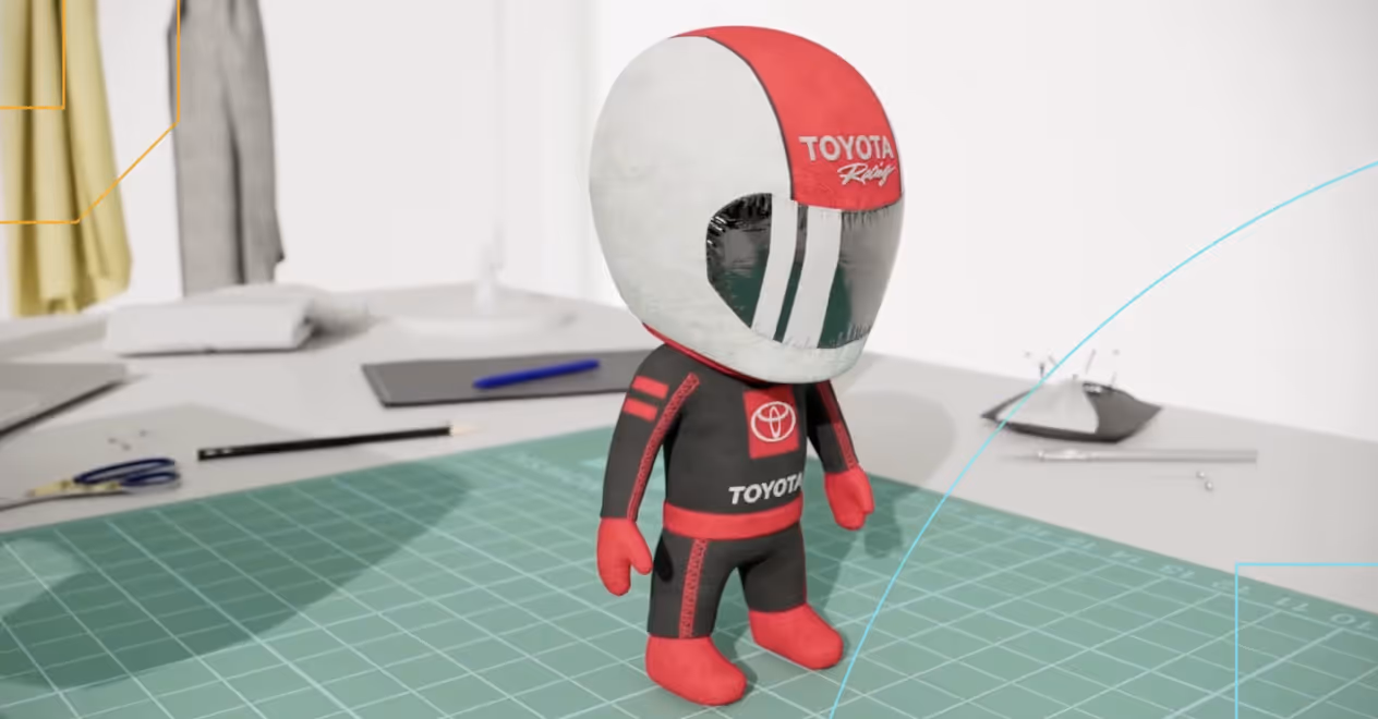 Small figurine of a racing driver with Toyota Racing suit and helmet on a green cutting mat.