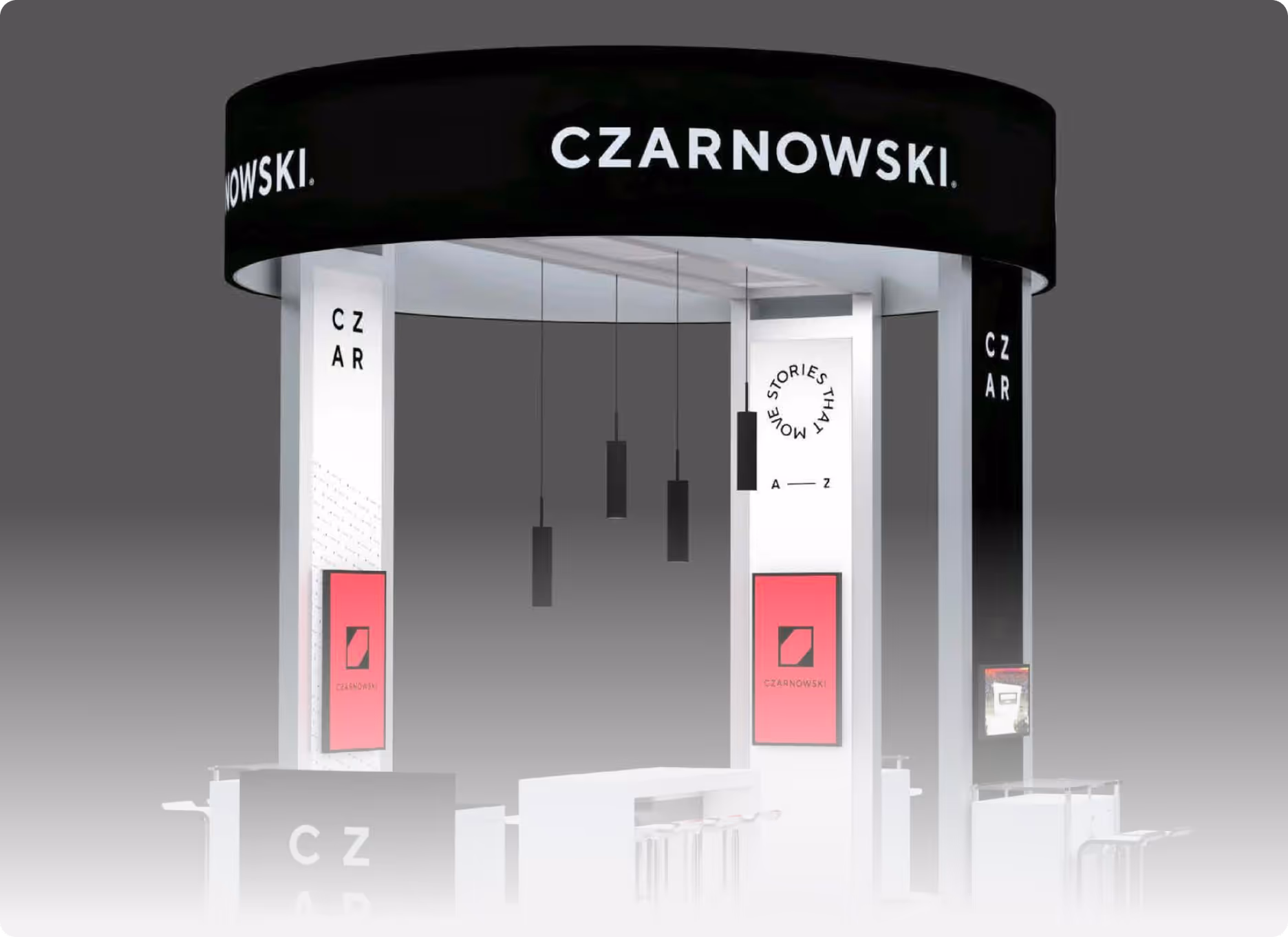 Modern exhibition booth with CZARNOWSKI branding and hanging black pendant lights.