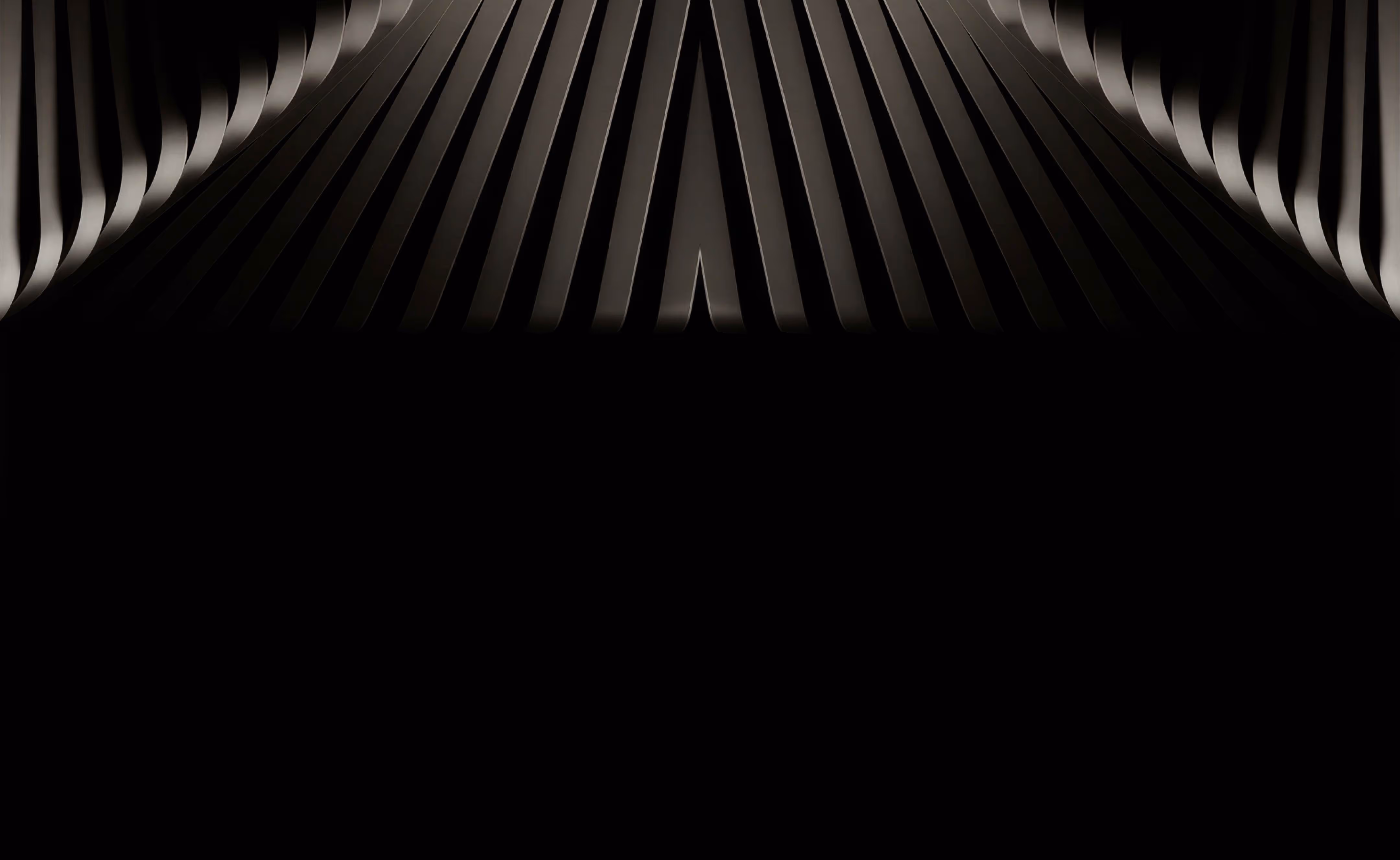 Symmetrical abstract black and gray curved lines forming a dark tunnel-like pattern.
