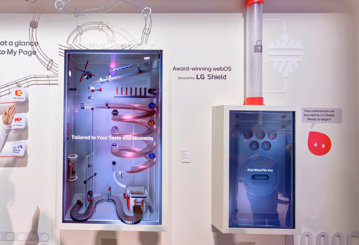 Interactive display featuring webOS secured by LG Shield with spirals and tubes guiding digital icons.