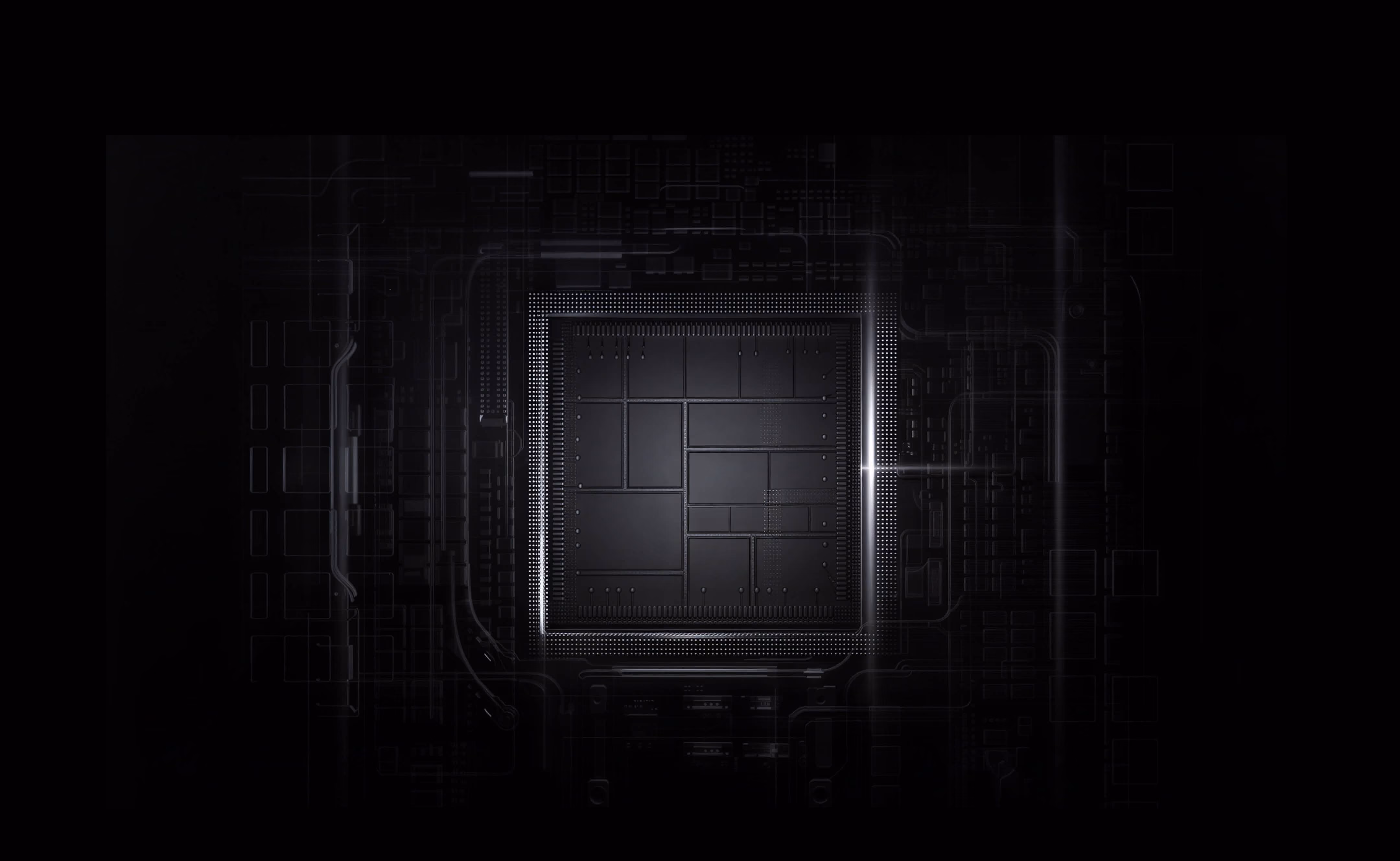 Close-up of a dark microchip with illuminated small circuitry and grid patterns.