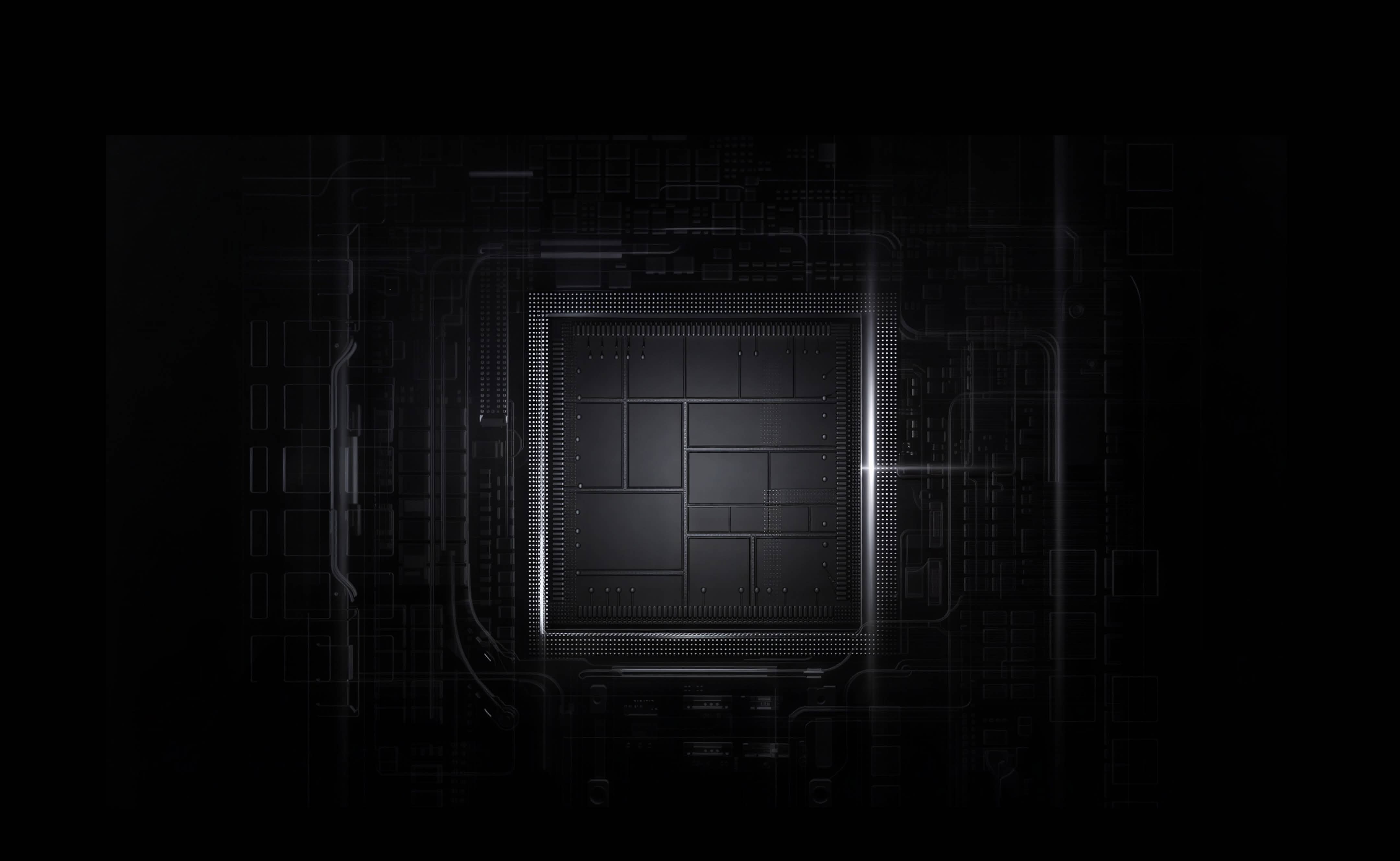Close-up of a dark microchip with illuminated small circuitry and grid patterns.