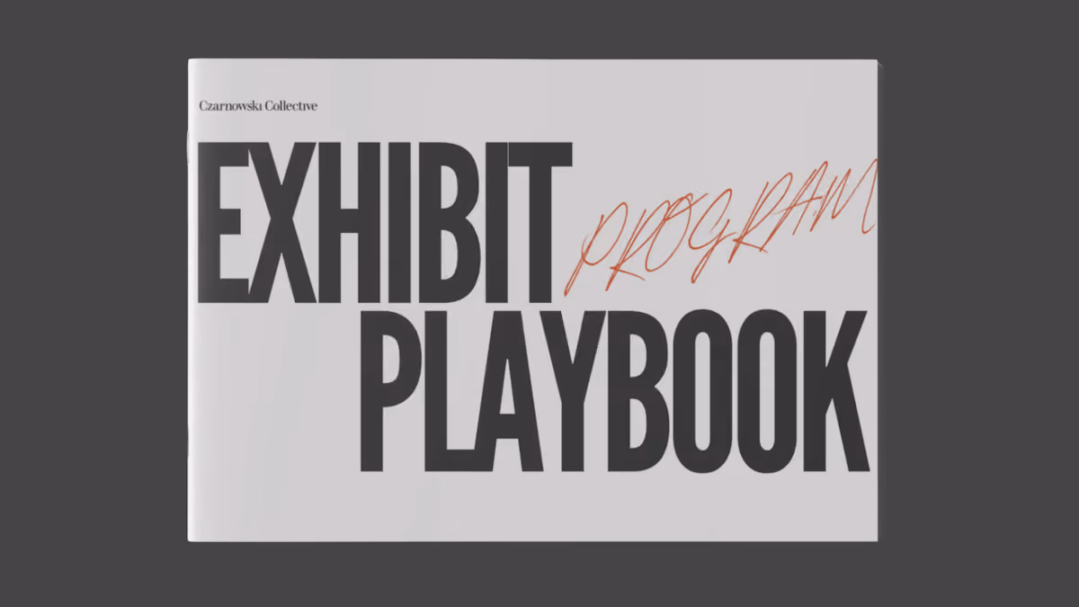 Front cover of a booklet titled 'Exhibit Playbook' with 'program' handwritten above it.