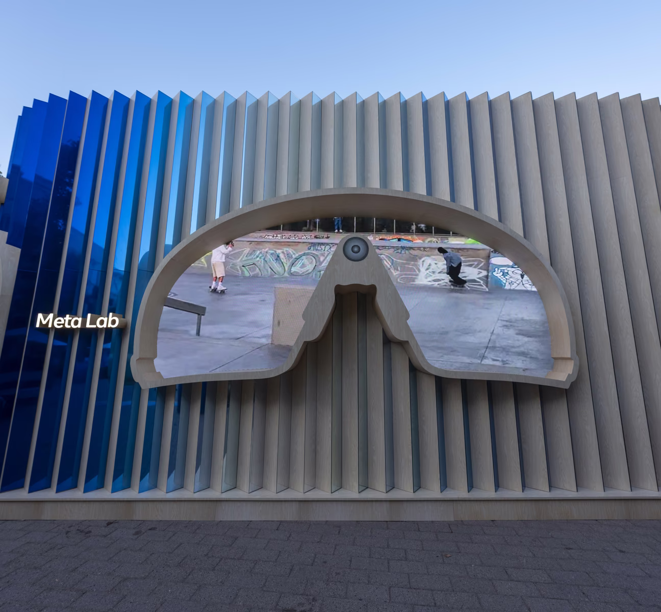 Meta Lab temporary structure at Meta Connect 2025 with a sunglasses-shaped window cut into a blue and wood fin facade