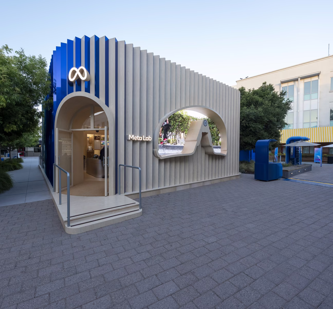 Exterior of the Meta Lab temporary structure at Meta Connect 2025 with arched entrance and Meta logo