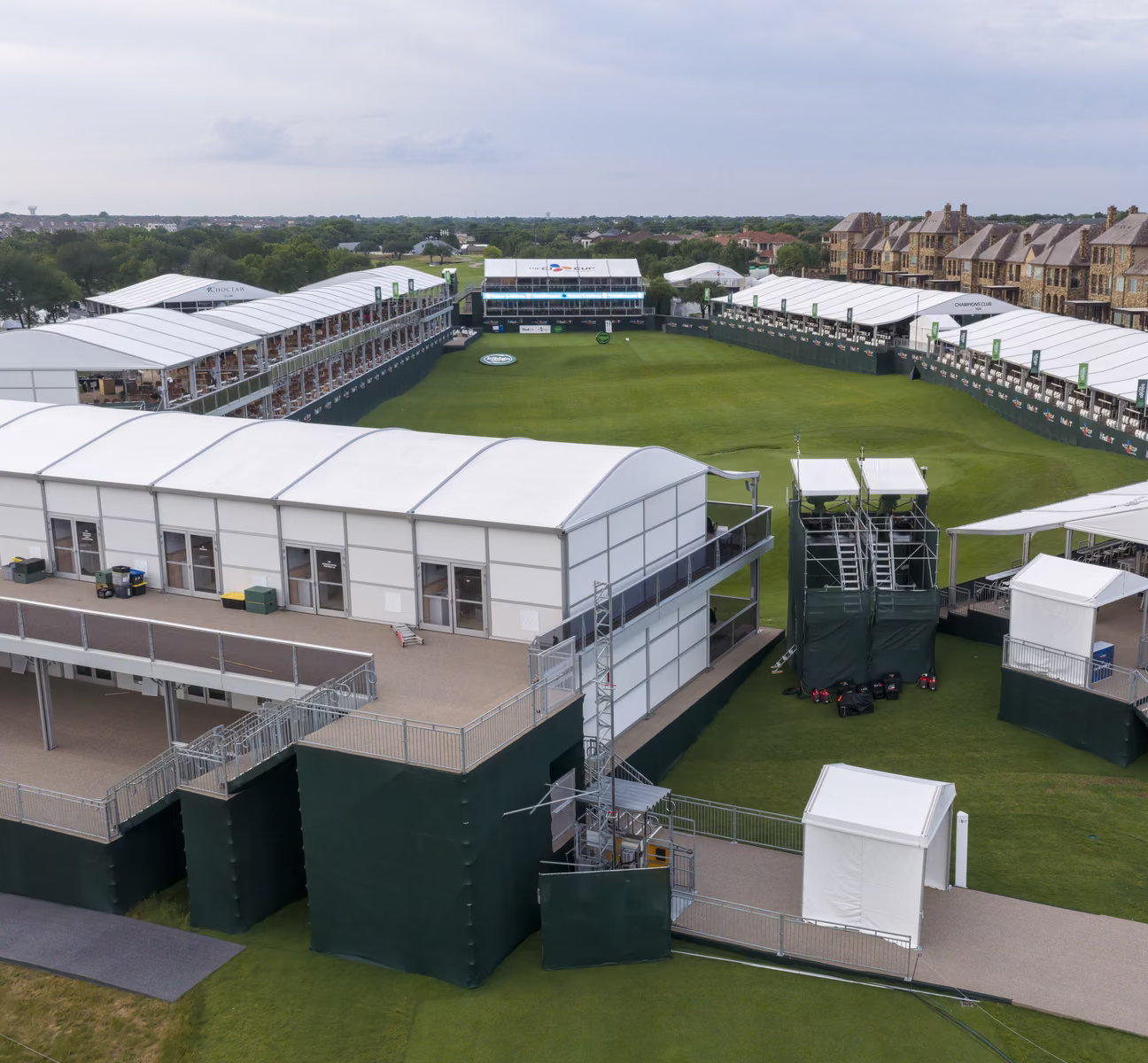 Aerial view of the multi-level temporary hospitality structures surrounding the 18th green at the CJ Cup Byron Nelson
