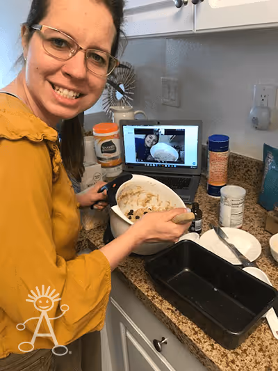 Sarah and her program coach making banana bread