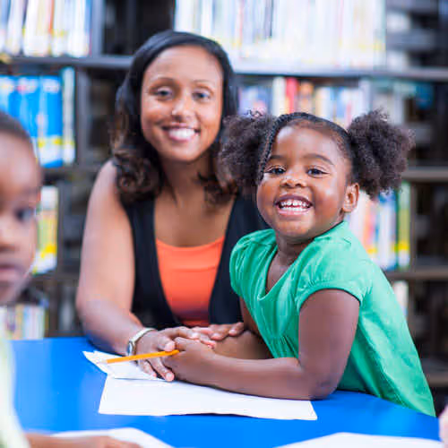 child and childcare worker at the library