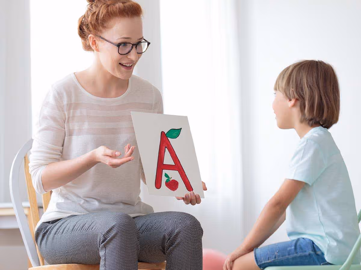 Therapist working with child