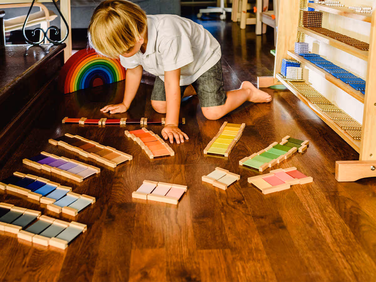 child playing with colorful toys