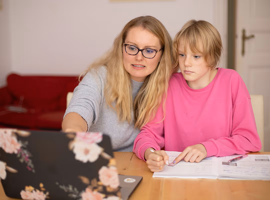 mom and daughter working on the computer