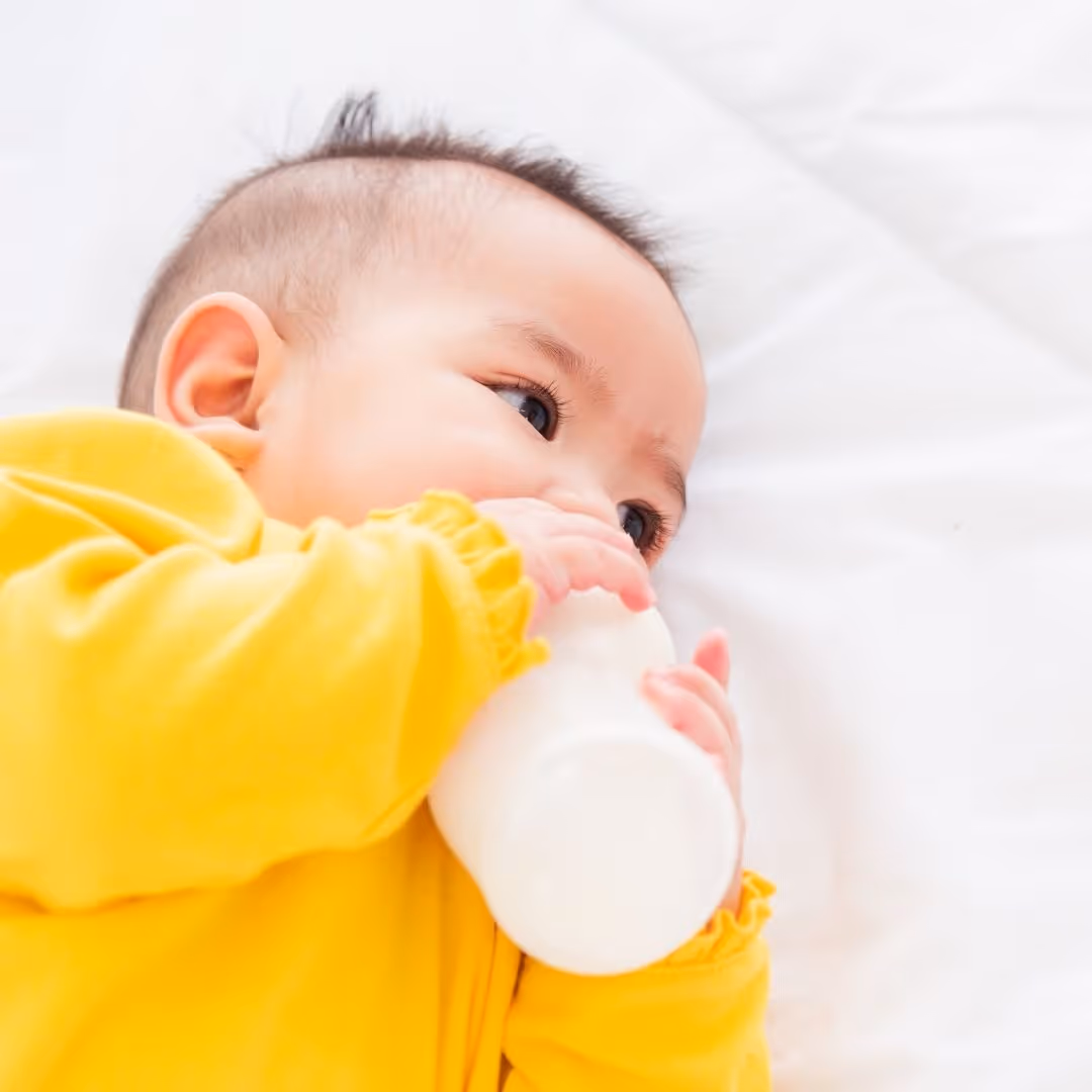 an infant drinking from a bottle