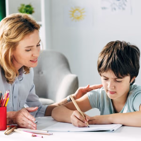 mother helps her child with homework