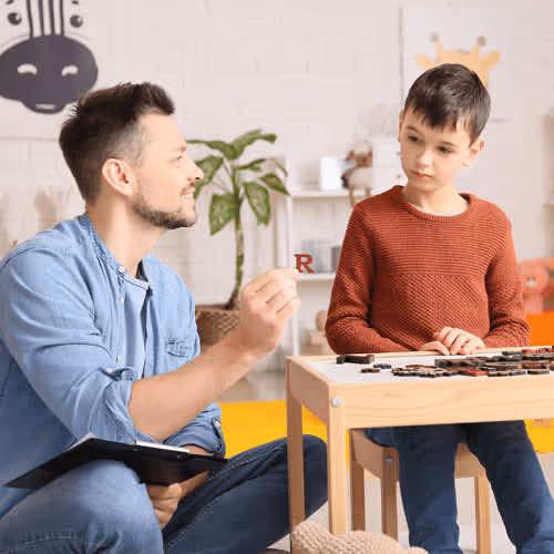 Teacher Helping Student