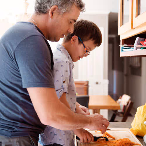 father and son cooking
