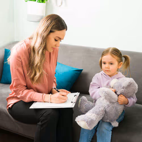 child working with therapist