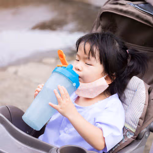 young child drinking water