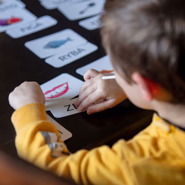 child working with flash cards