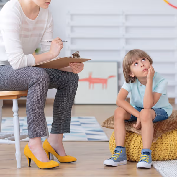 therapist observing child's behavior