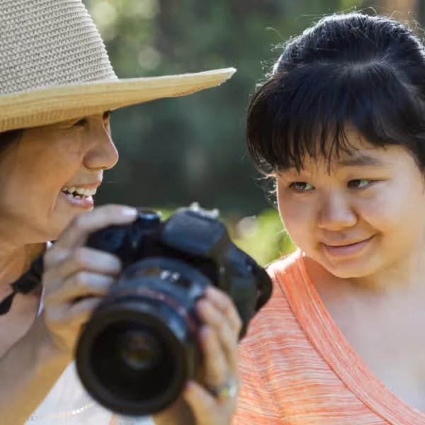 a child and adult out taking photos
