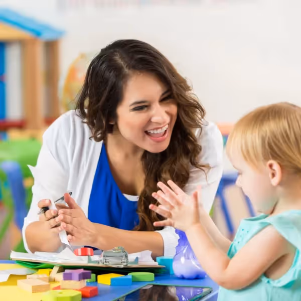 woman clapping with child