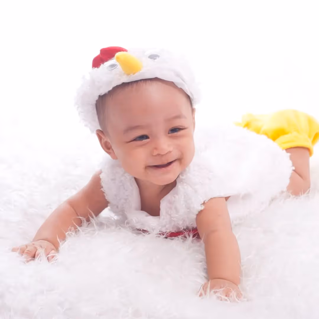 smiling infant turning head