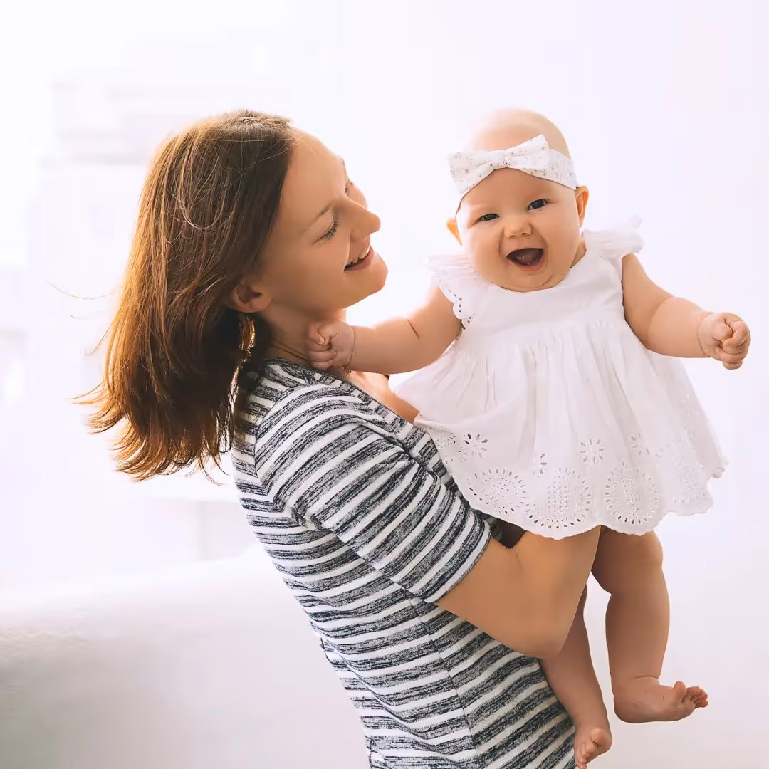 happy baby being held