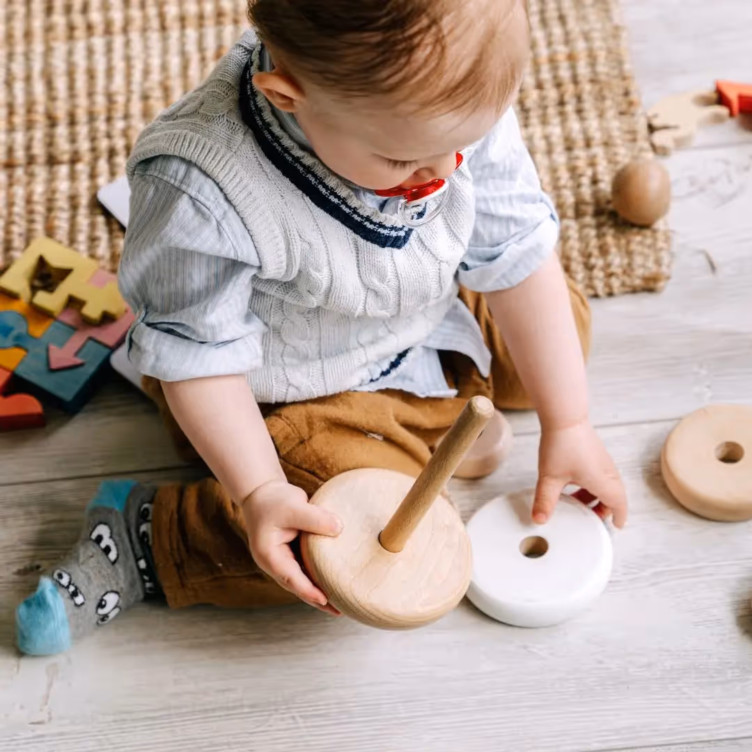 Young boy playing with a toy. 