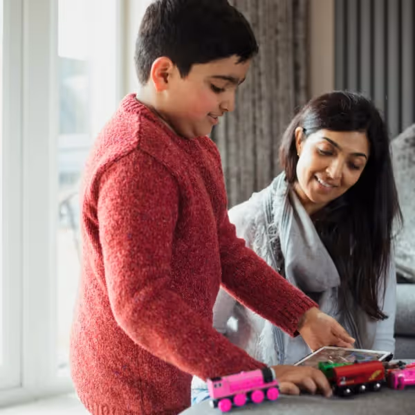 parent and son playing