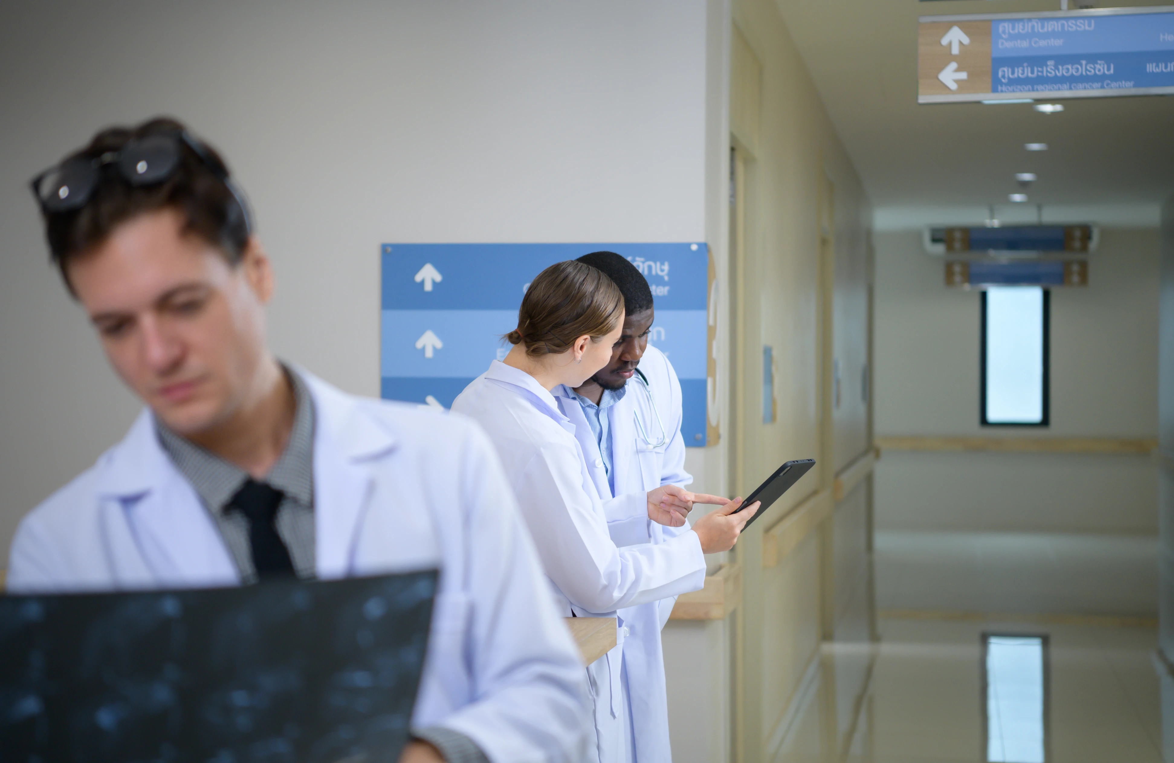 Medical team analyzing diagnostic imaging results together