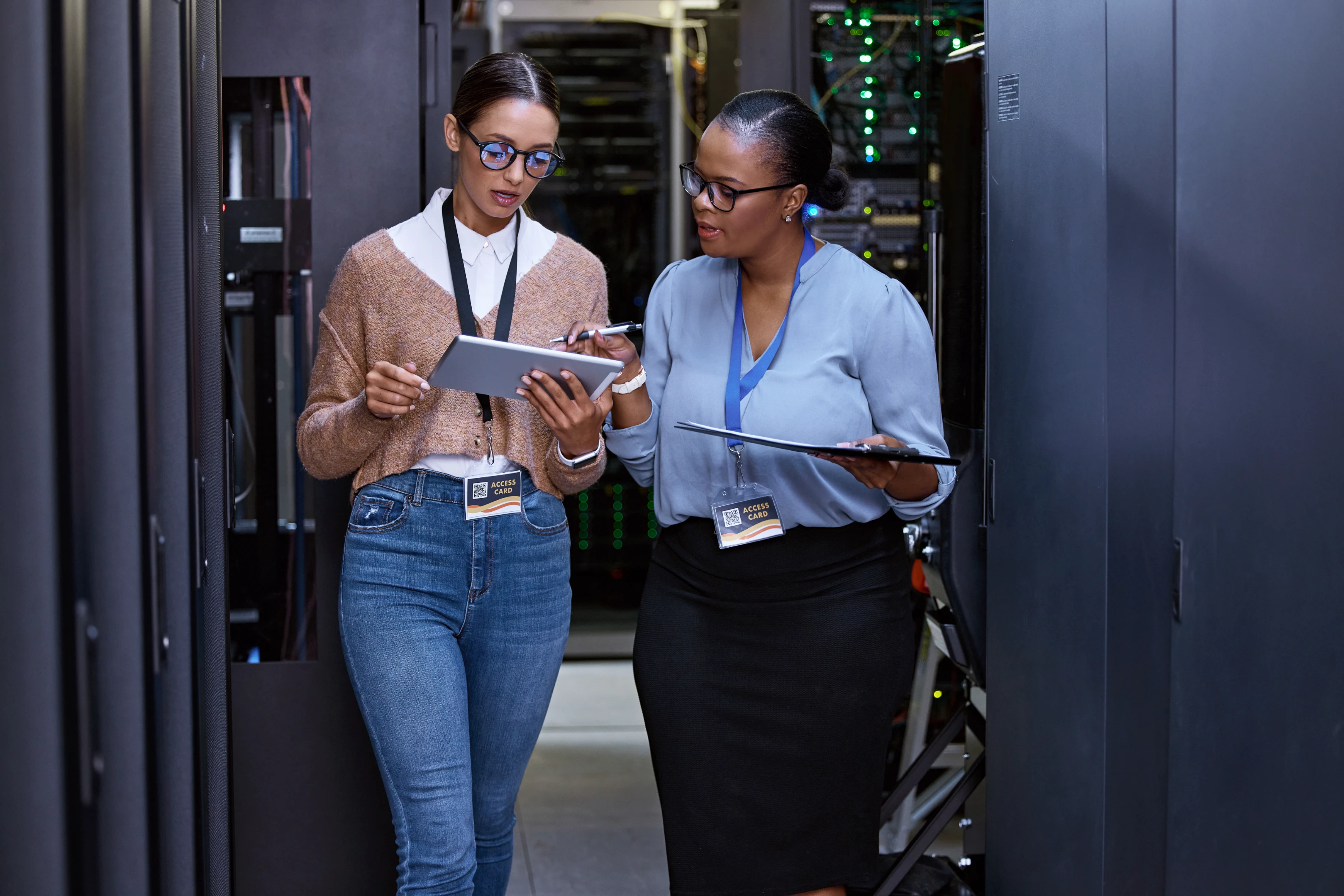 Female healthcare IT analysts working together on data systems