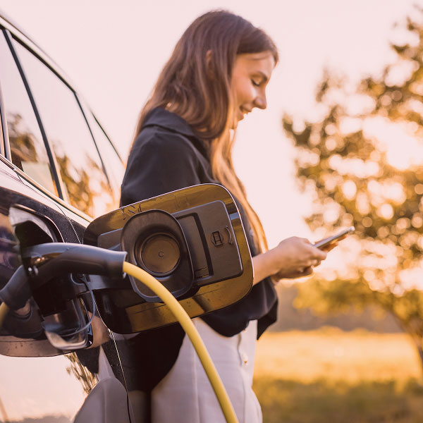 Woman fueling her car