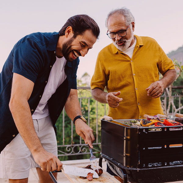 Two mean cooking food