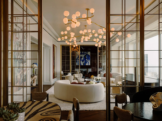 A living room filled with furniture and a chandelier.