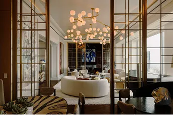 A living room filled with furniture and a chandelier.