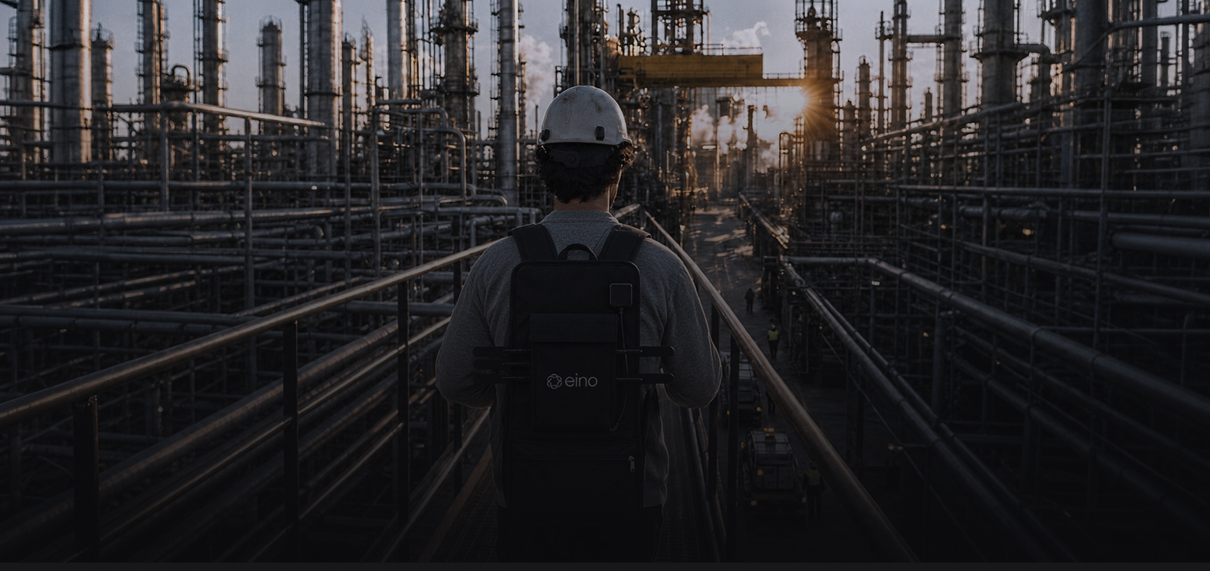 Field engineer wearing the eino Site Survey walk test backpack at an industrial site