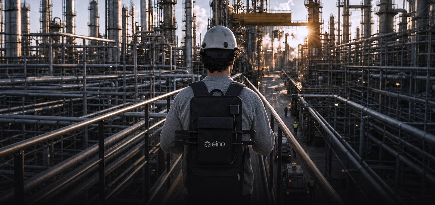 Field engineer wearing the eino Site Survey walk test backpack at an industrial site