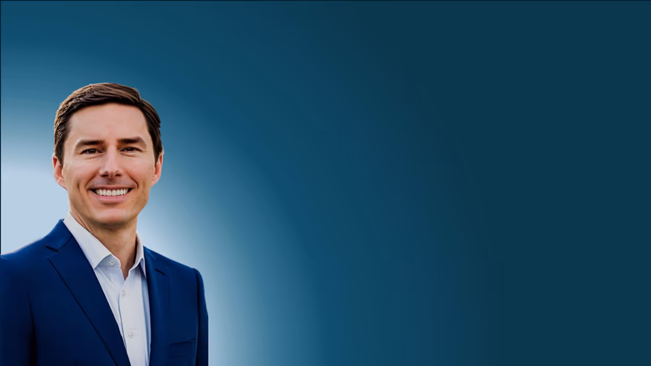 A picture of the Managing Director in a blue suit