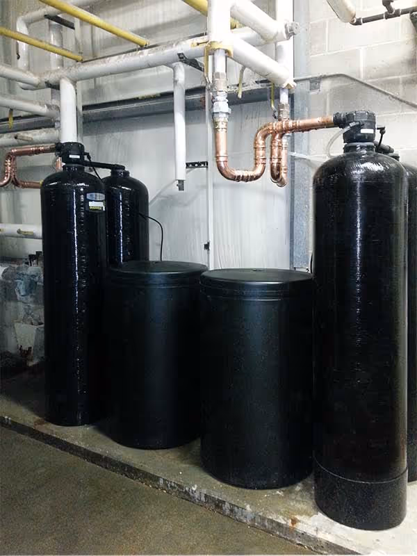 Commercial water system installation with three large tanks