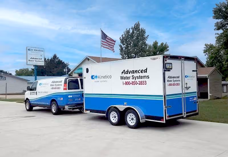 Advanced Water Systems storefront with salt delivery van and trailer