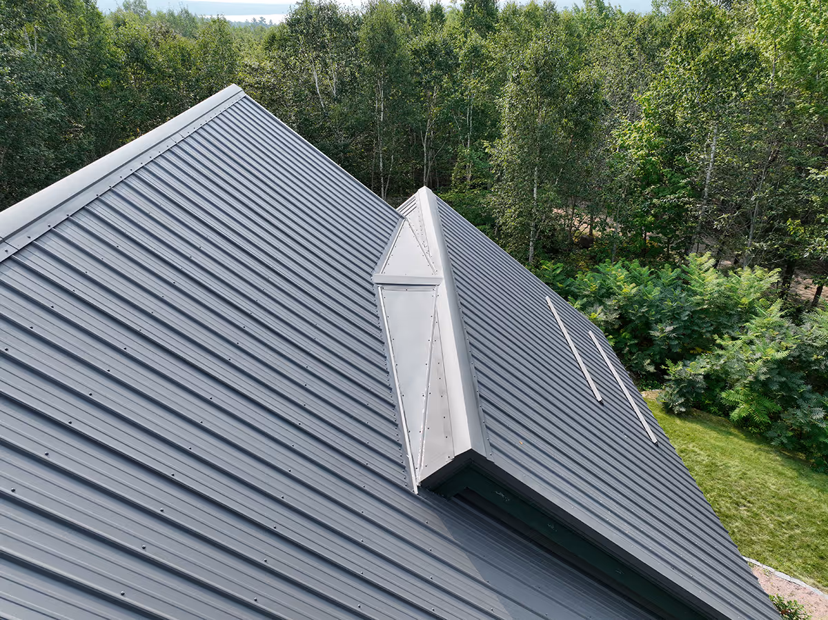 Roofing materials sample displaying available shingle or metal panel options.