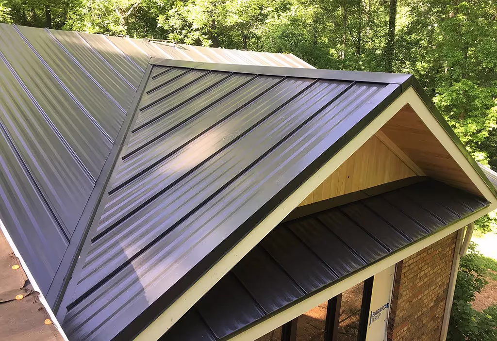 Close-up of standing seam metal roof panels showing clean vertical lines and raised seams.
