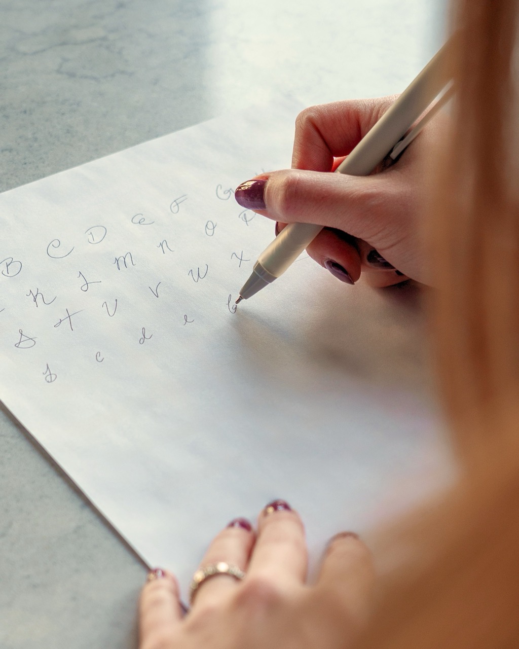 Hand writing a handwriting sample with a pen