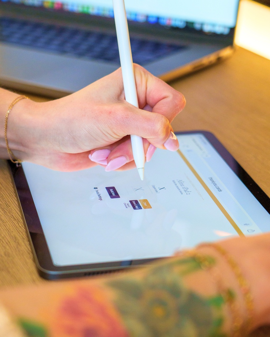 Customer drawing handwriting on a tablet to create a font
