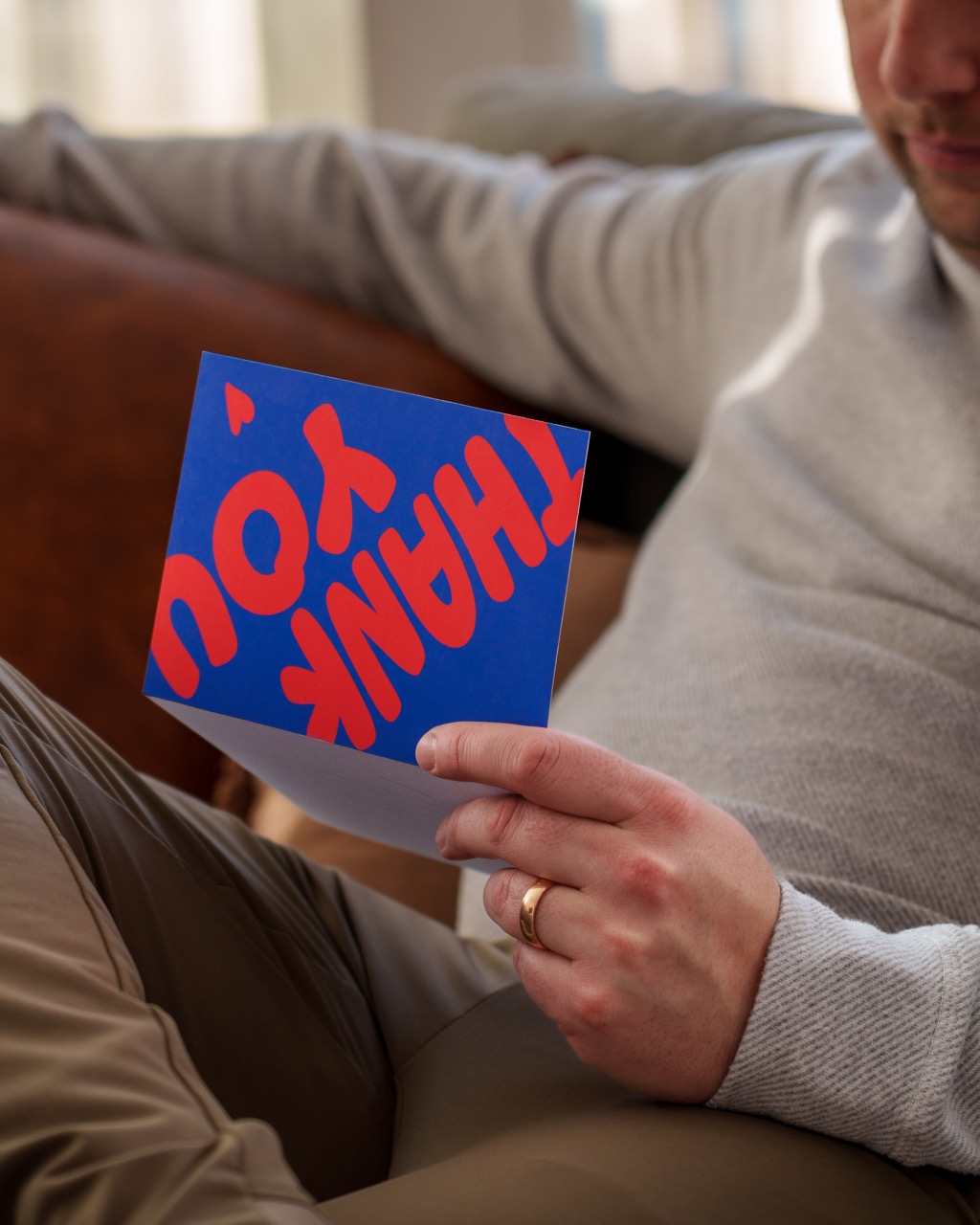 Recipient opening a bold thank you card