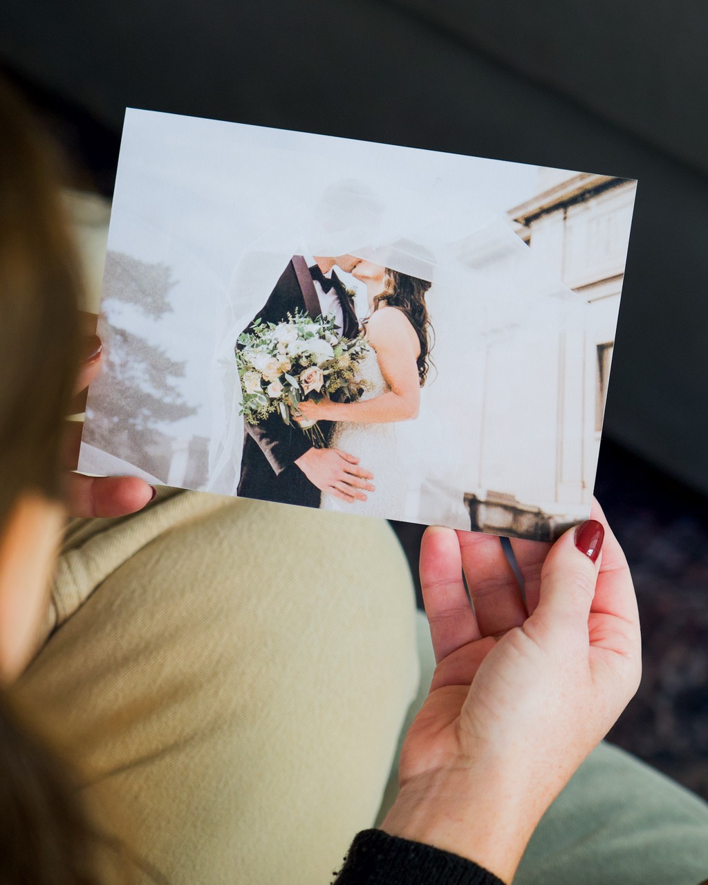 Newlywed reading the inside of a folded handwritten card