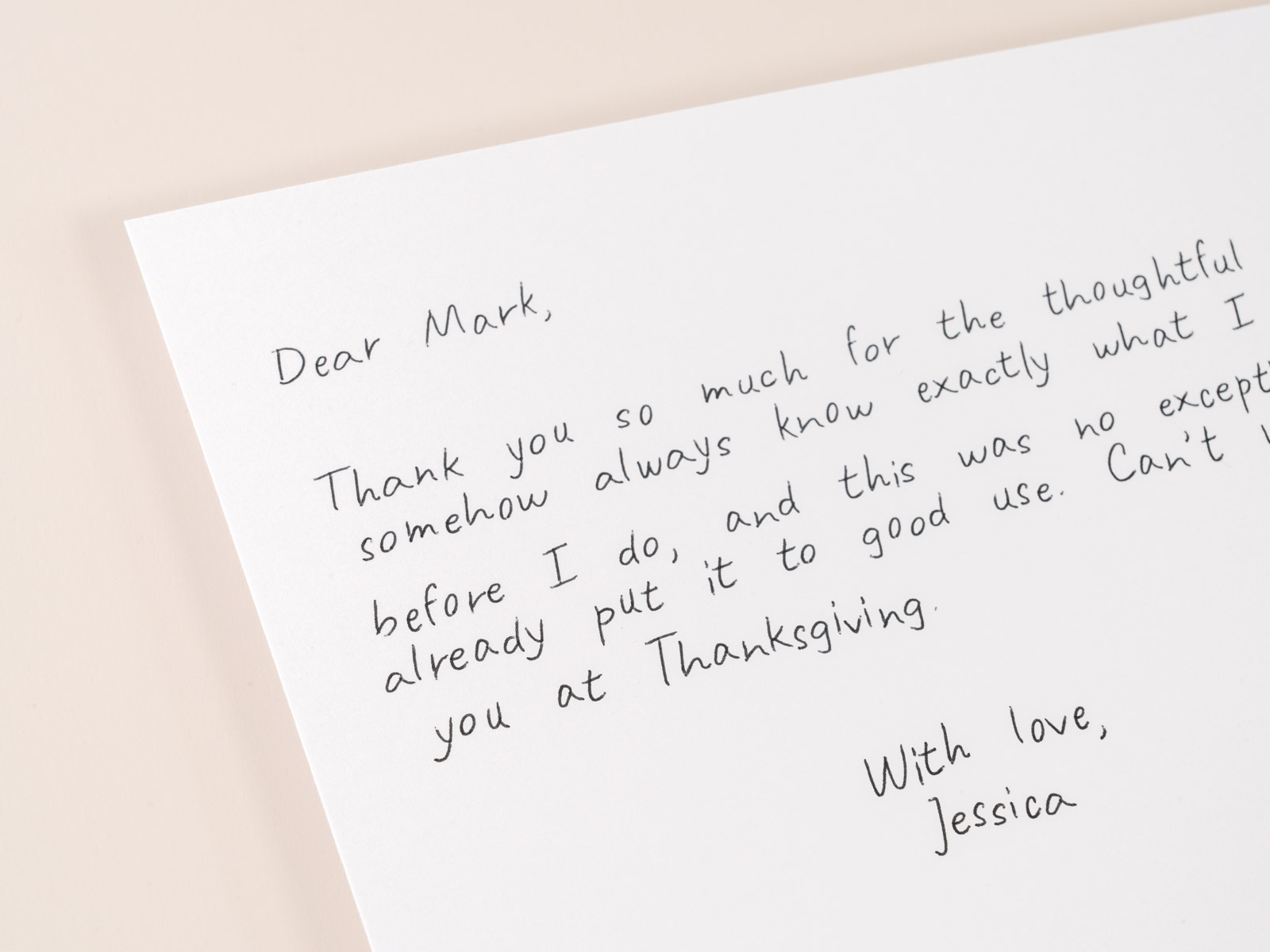 Macro close-up of real pen ink strokes in a handwritten card message