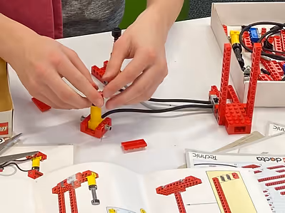 image of volunteer teaching children