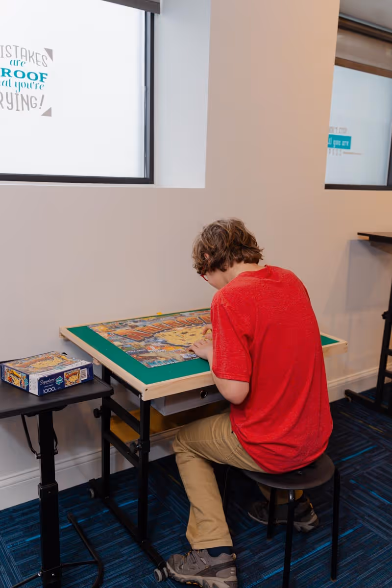 image of a teacher interacting with students using digital tools (for edtech)