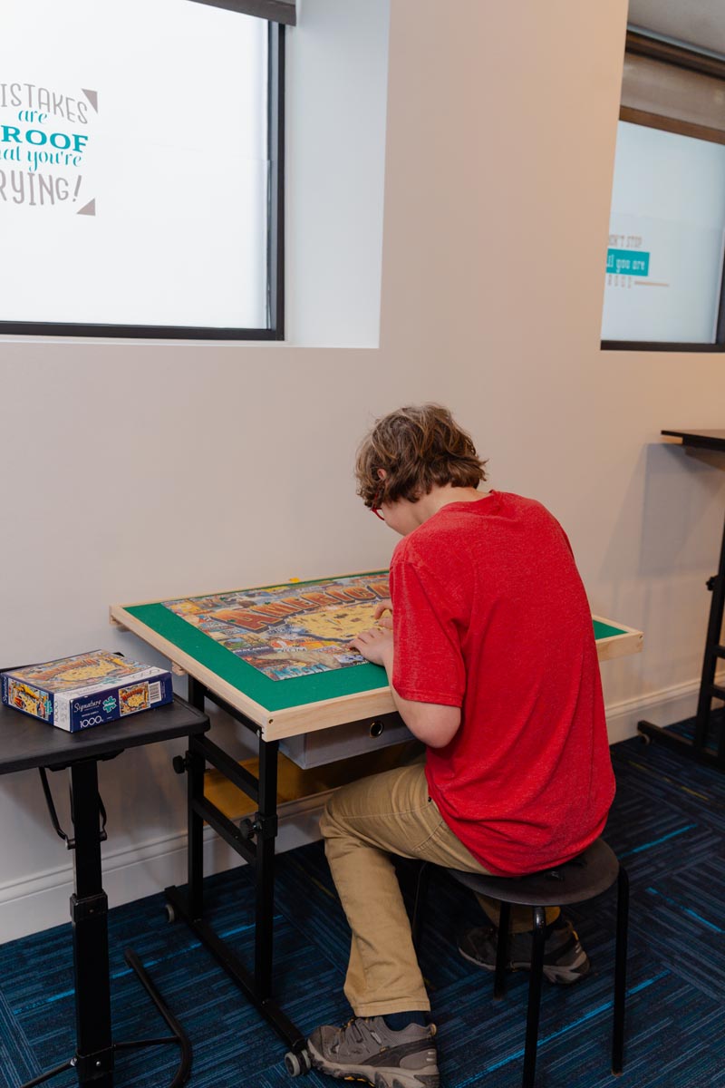 image of a teacher interacting with students using digital tools (for edtech)